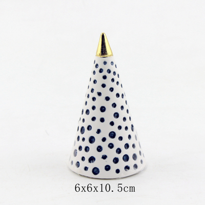 white and gold ring cone